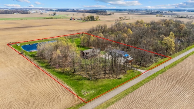 birds eye view of property with a rural view
