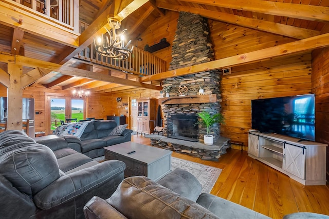 living area featuring wood ceiling, wooden walls, a chandelier, and wood-type flooring