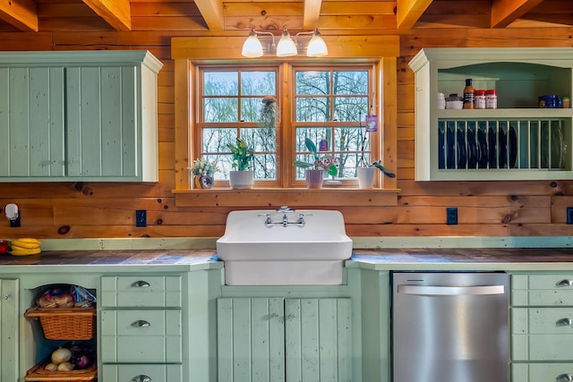 room details featuring green cabinetry, wood walls, and tile countertops