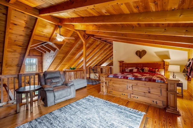 bedroom with wood ceiling, vaulted ceiling with beams, and hardwood / wood-style floors
