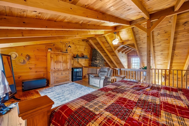 bedroom featuring wood ceiling, wood walls, hardwood / wood-style flooring, and vaulted ceiling with beams
