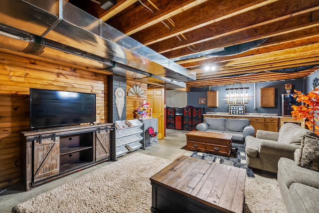 living area featuring concrete floors and washer and clothes dryer
