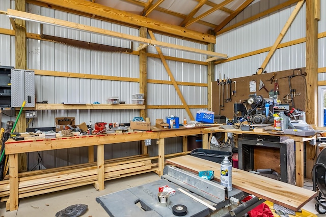 garage with a workshop area and metal wall