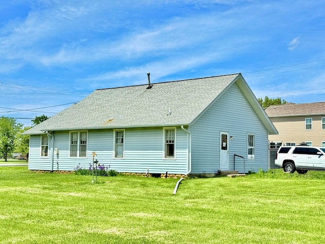 15825 State Route 207, Mount Sterling, OH 43143 - rear view of house featuring a lawn and roof with shingles