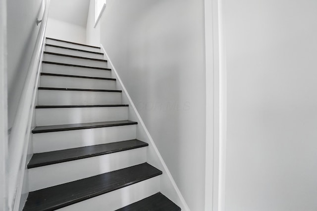 stairs featuring baseboards