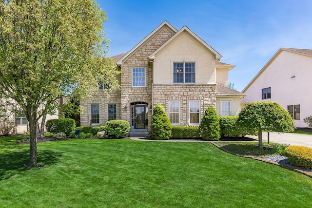 6509 Spring Run Dr, Westerville, OH 43082 - view of front of home with a front yard, stone siding, and stucco siding