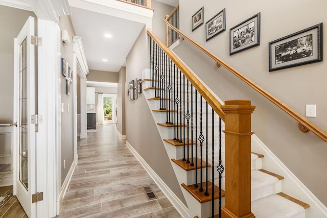 6509 Spring Run Dr, Westerville, OH 43082 - staircase featuring baseboards, recessed lighting, wood finished floors, and visible vents