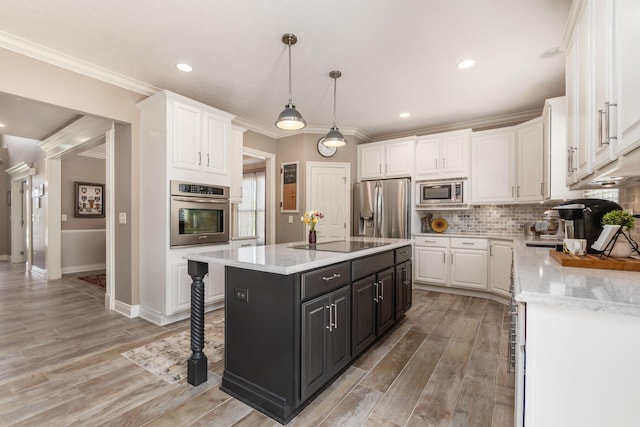 6509 Spring Run Dr, Westerville, OH 43082 - kitchen featuring white cabinets, stainless steel appliances, crown molding, and a kitchen island