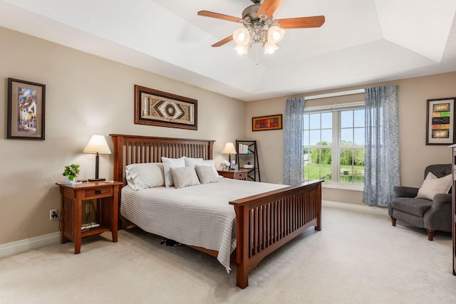 6509 Spring Run Dr, Westerville, OH 43082 - bedroom featuring baseboards, a tray ceiling, and light colored carpet