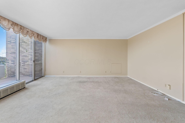 1000 Urlin Ave Unit 520, Columbus, OH 43212 - carpeted spare room featuring ornamental molding and radiator