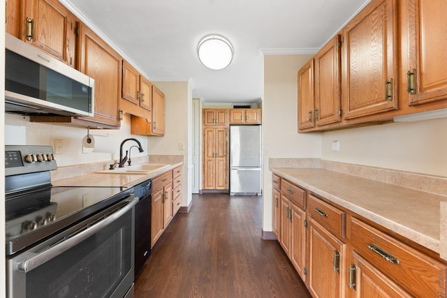1000 Urlin Ave Unit 520, Columbus, OH 43212 - kitchen featuring appliances with stainless steel finishes, dark wood-style flooring, ornamental molding, light countertops, and brown cabinetry
