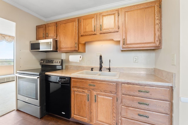 1000 Urlin Ave Unit 520, Columbus, OH 43212 - kitchen featuring stainless steel appliances, light countertops, crown molding, and dark wood-style flooring