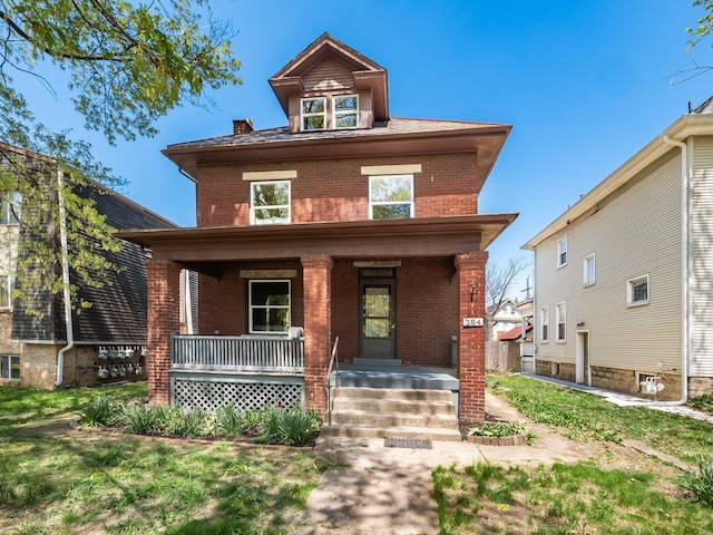 384 E 13th Ave, Columbus, OH 43201 - american foursquare style home with a porch and brick siding