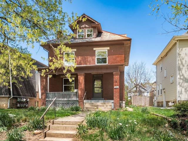 384 E 13th Ave, Columbus, OH 43201 - american foursquare style home featuring brick siding and a porch