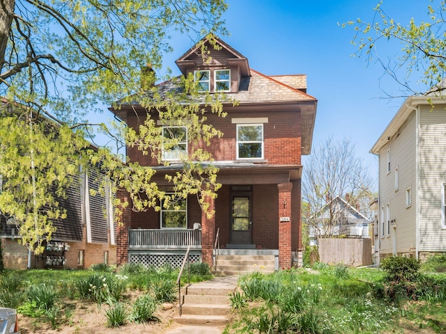 384 E 13th Ave, Columbus, OH 43201 - american foursquare style home with brick siding, a porch, and a chimney