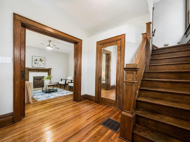 384 E 13th Ave, Columbus, OH 43201 - interior space with wood finished floors, visible vents, a ceiling fan, baseboards, and a fireplace