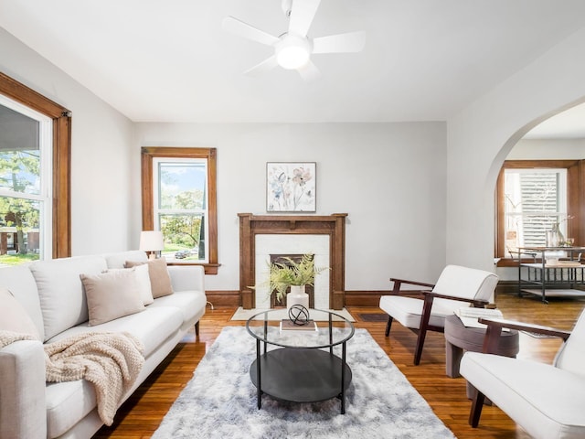 384 E 13th Ave, Columbus, OH 43201 - living area featuring arched walkways, a healthy amount of sunlight, and a ceiling fan