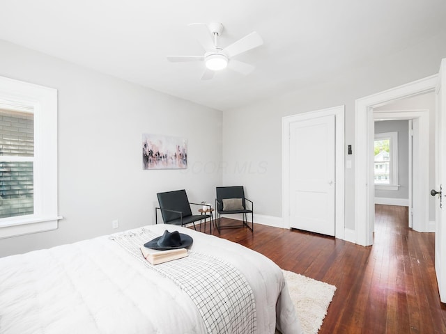 384 E 13th Ave, Columbus, OH 43201 - bedroom with hardwood / wood-style floors, a ceiling fan, and baseboards