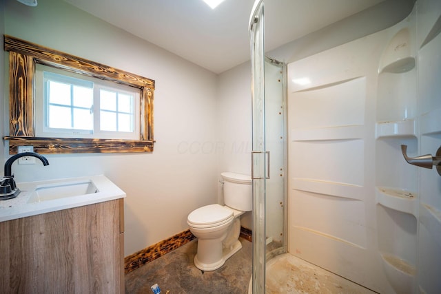 bathroom featuring toilet, baseboards, a shower stall, and vanity