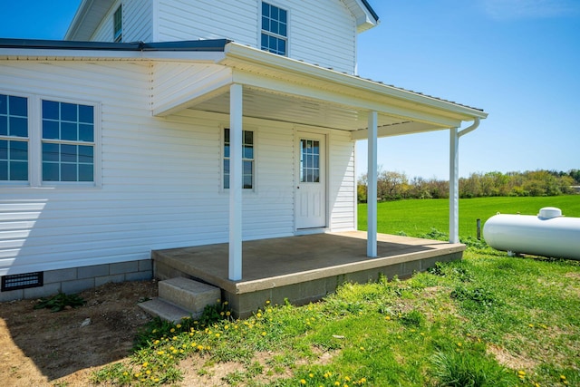 entrance to property with a yard
