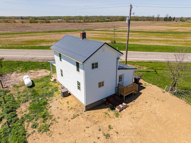 birds eye view of property featuring a rural view