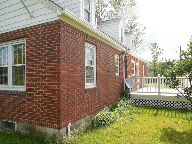 4228 State Route 229, Marengo, OH 43334 - view of property exterior featuring a wooden deck, brick siding, and a lawn