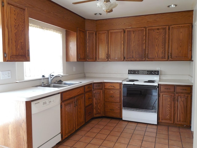 4228 State Route 229, Marengo, OH 43334 - kitchen with white appliances, brown cabinets, ceiling fan, and light countertops