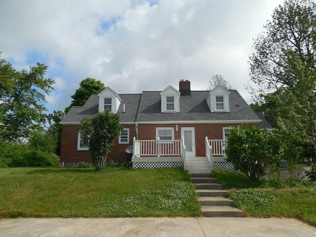 4228 State Route 229, Marengo, OH 43334 - cape cod home with brick siding, a chimney, a deck, a front yard, and roof with shingles