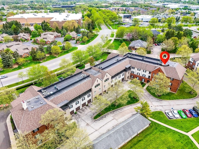 birds eye view of property with a residential view