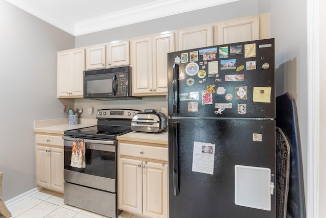 kitchen featuring crown molding, light countertops, light tile patterned floors, baseboards, and black appliances