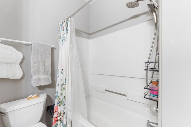 bathroom featuring toilet and shower / bath combo