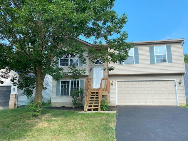 829 Crevis Ln, Columbus, OH 43228 - split foyer home with driveway, a garage, and a front yard