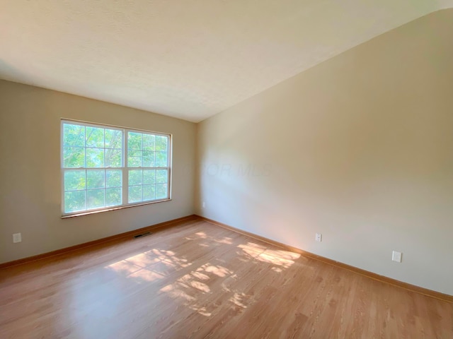 829 Crevis Ln, Columbus, OH 43228 - empty room with baseboards and light wood finished floors