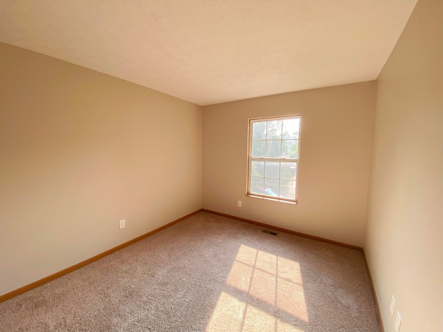 829 Crevis Ln, Columbus, OH 43228 - carpeted spare room featuring baseboards and a textured ceiling