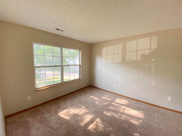 829 Crevis Ln, Columbus, OH 43228 - carpeted spare room featuring a textured ceiling and baseboards
