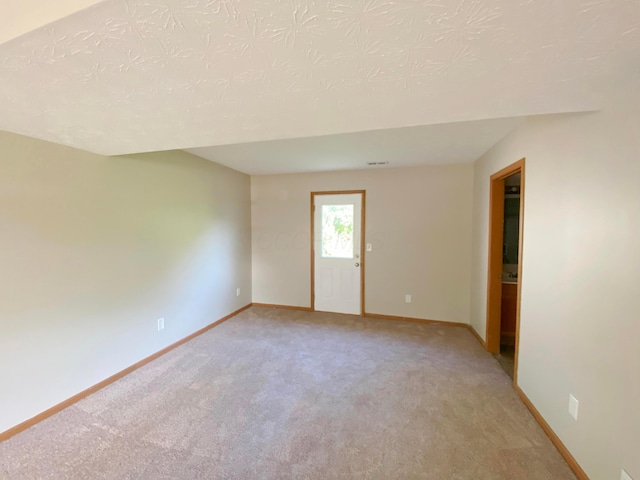 829 Crevis Ln, Columbus, OH 43228 - unfurnished room featuring light carpet and a textured ceiling