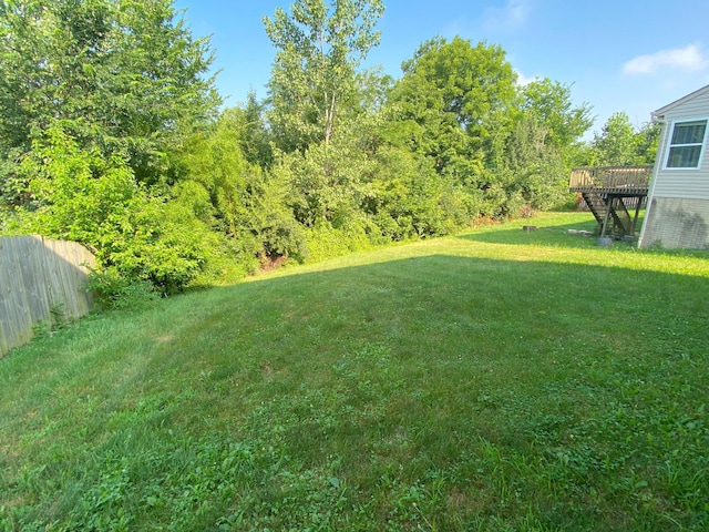 829 Crevis Ln, Columbus, OH 43228 - view of yard featuring a wooden deck and stairway