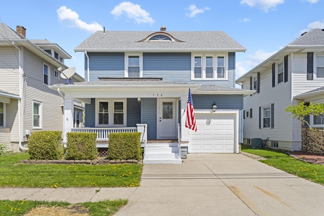 american foursquare style home featuring an attached garage, a shingled roof, covered porch, and driveway