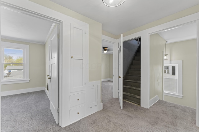 interior space with carpet floors and baseboards