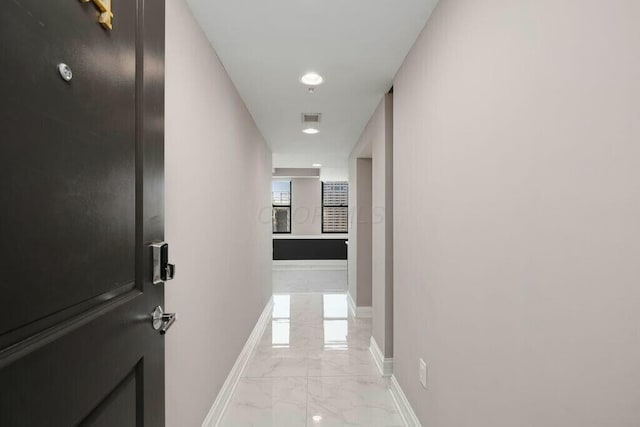 50 W Broad St Unit 2104, Columbus, OH 43215 - corridor featuring visible vents, marble finish floor, and baseboards