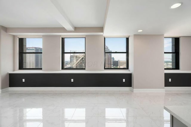 50 W Broad St Unit 2104, Columbus, OH 43215 - spare room featuring recessed lighting, beam ceiling, marble finish floor, and baseboards