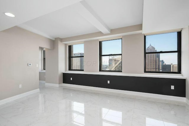 50 W Broad St Unit 2104, Columbus, OH 43215 - empty room with baseboards, marble finish floor, and beam ceiling