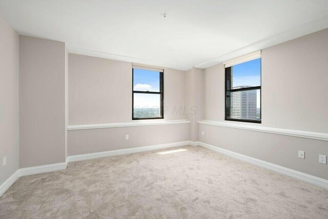 50 W Broad St Unit 2104, Columbus, OH 43215 - carpeted empty room featuring baseboards