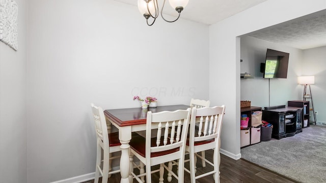 650 Licking View Dr, Heath, OH 43056 - dining room featuring wood finished floors, a chandelier, and baseboards