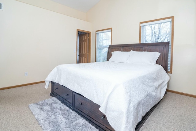 bedroom with lofted ceiling, baseboards, carpet flooring, and visible vents