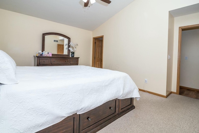 bedroom with vaulted ceiling, visible vents, a ceiling fan, baseboards, and carpet flooring