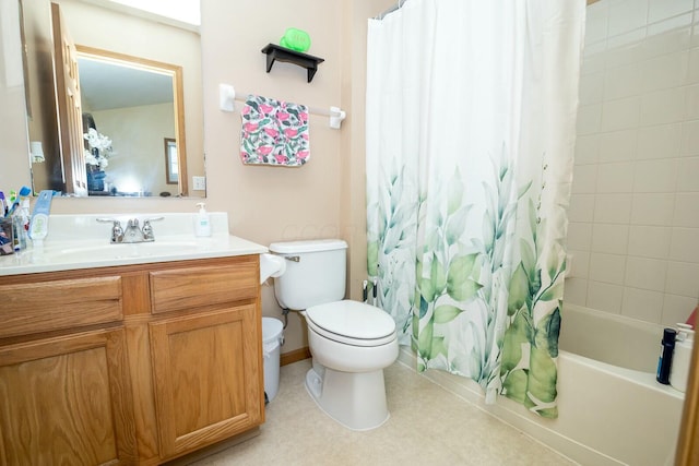 bathroom featuring toilet, vanity, and shower / bath combo with shower curtain