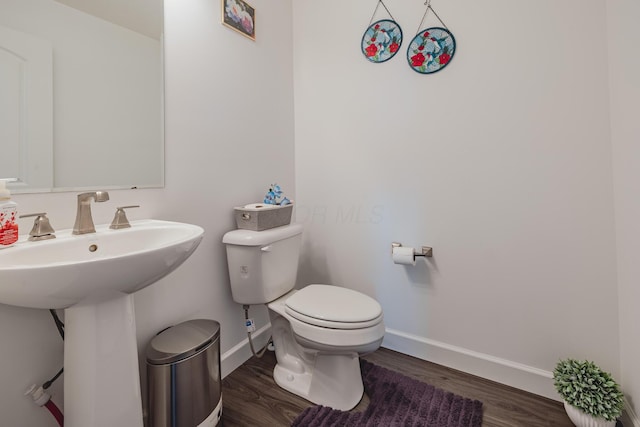 9295 Dewitt Dr, Plain City, OH 43064 - bathroom featuring toilet, baseboards, a sink, and wood finished floors