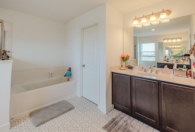9295 Dewitt Dr, Plain City, OH 43064 - bathroom featuring vanity, baseboards, and a bath