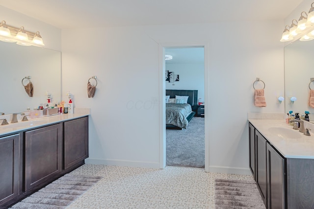 9295 Dewitt Dr, Plain City, OH 43064 - full bath featuring a sink, baseboards, ensuite bathroom, and two vanities